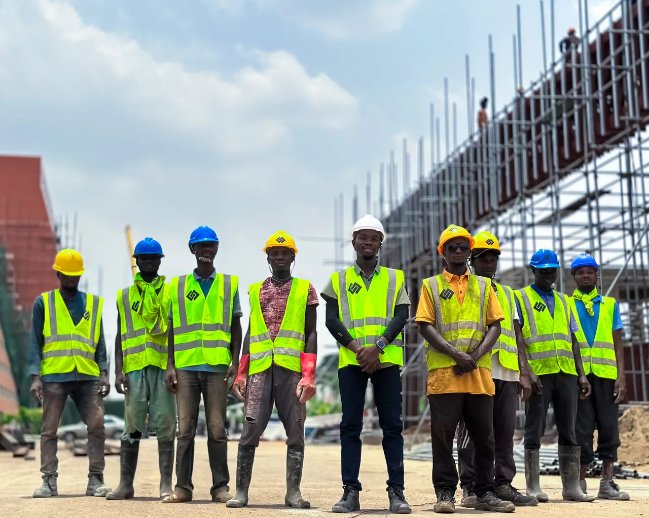 Field team safety — workers wearing protective equipment at a construction site